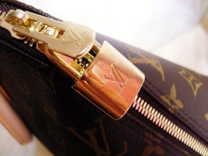 Living lusciously - louis Vuitton handbag clasp.jpg
